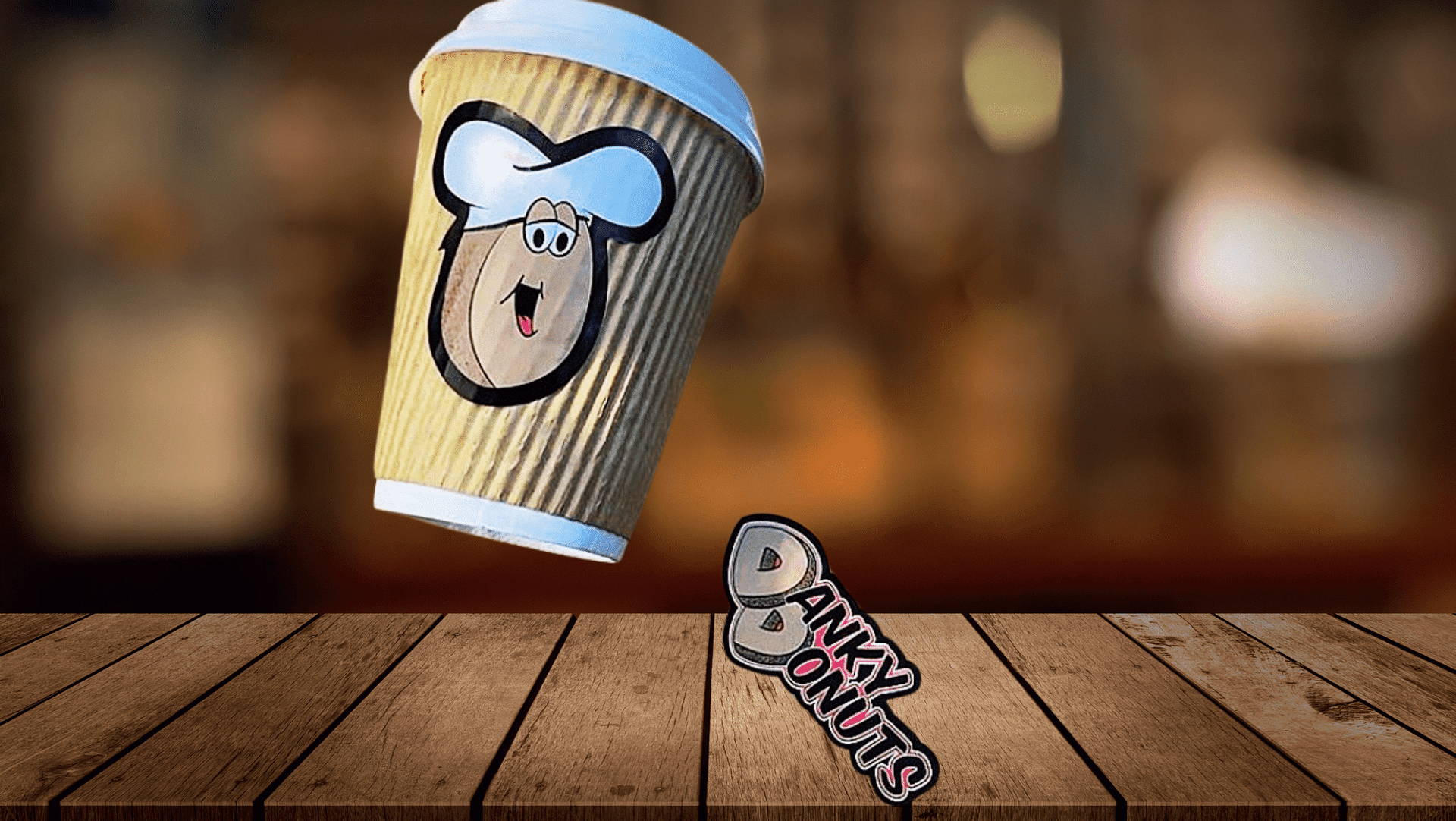 Illustration of a coffee cup with a cartoon chef logo, and the text "BANKY DONUTS" underneath.